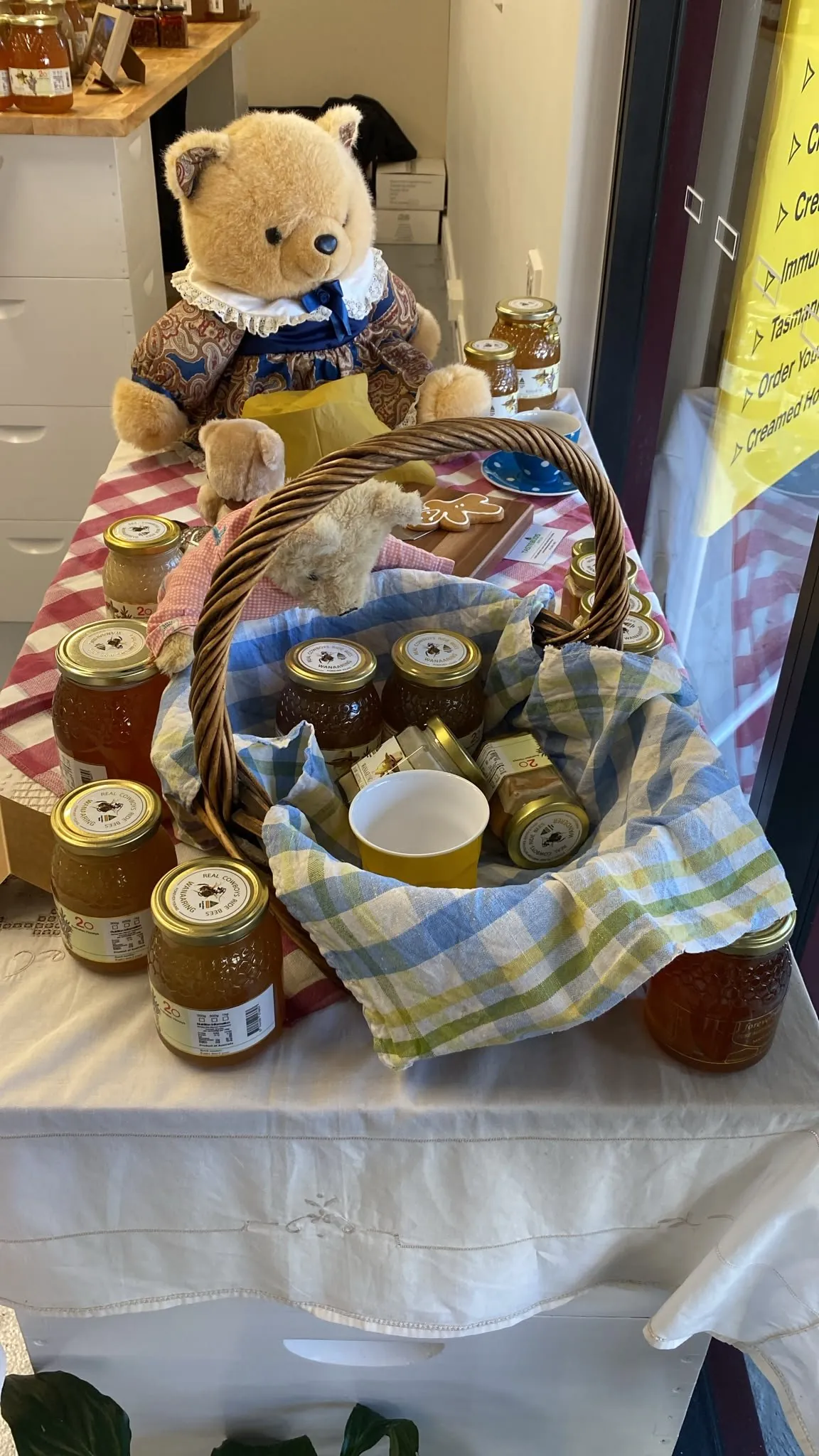 Jars of raw honey on the bench in the Wanderer Honey shop
